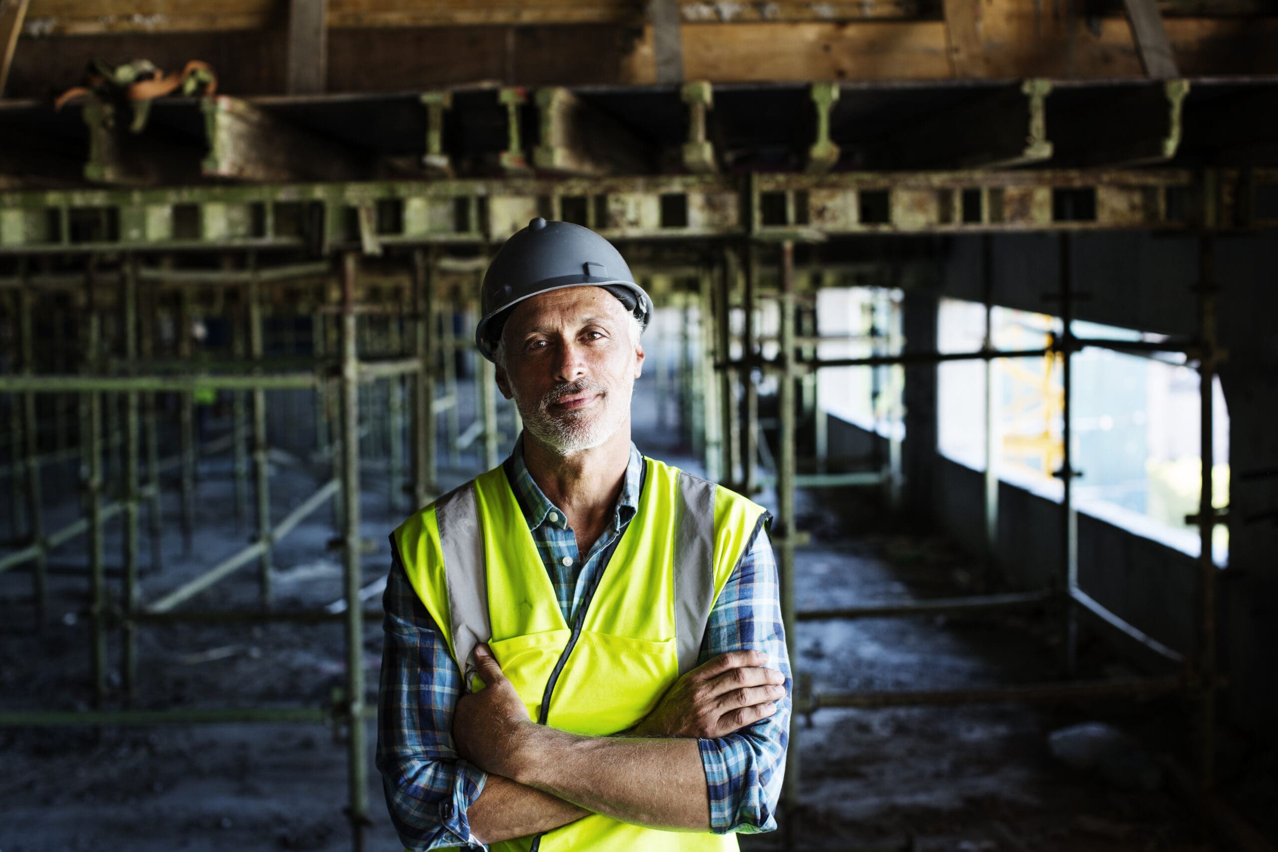 Worker standing at construction site